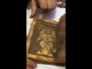 an old book, the talmud, sewn with gold (minute 1 27 the true god of the jews)